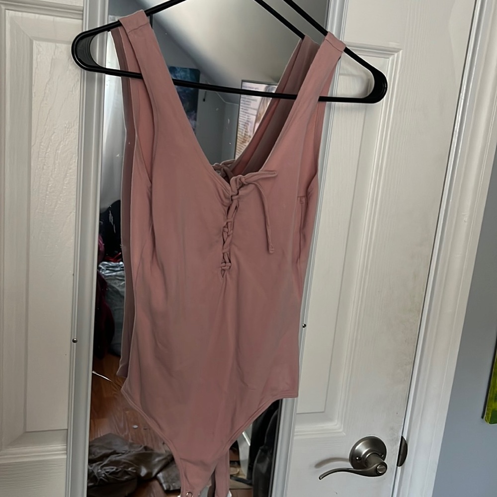 ME to WE pink bodysuit.